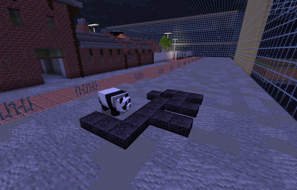 The Dutil-Dumas symbol of 'force' is built with dark grey 'Polished Blackstone Slab' on the main road outside the virtual space of Cattle Depot. The image shows a night scene with street lights in the background. The front entrance of Cattle Depot is on the left. A panda bear is checking out the newly built sign on a starry night, to see if there's anything suspicious.