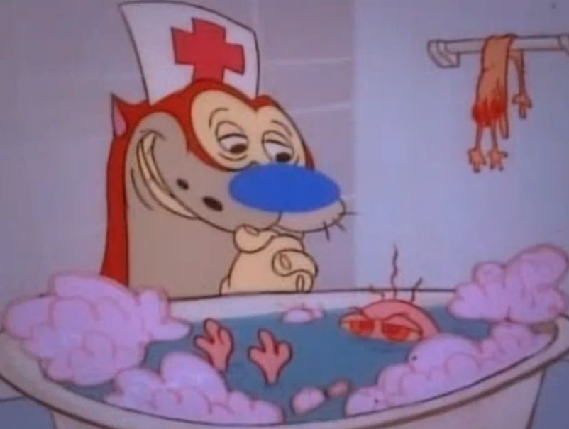 A screenshot from the cartoon The Ren and Stimpy Show. Ren is a small and hairless chihuahua dog with beige skin, pink eyes and floppy long pink ears. Stimpy is red/orange Manx cat with a white tummy and hands, wth a round blue nose and a pink tongue often hanging out of his mouth. In this screenshot we see Ren submerged in a freestanding white roll top bath with blue water and pink bubbles, only his eyes and feet are visible out of the water and he looks a little annoyed. Looking over him is Stimpy looking down on them intensely but also lovingly with their hands clasped and smiling. In the background on the right is Ren's skin hung up on a towel rail. 