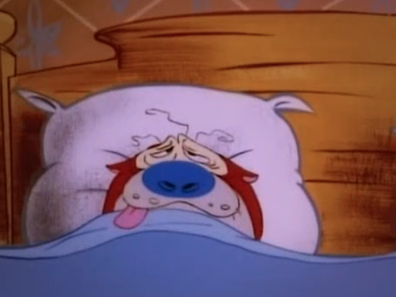 A screenshot from the cartoon The Ren and Stimpy Show. Ren is a small and hairless chihuahua dog with beige skin, pink eyes and floppy long pink ears. Stimpy is red/orange Manx cat with a white tummy and hands, wth a round blue nose and a pink tongue often hanging out of his mouth. In this screenshot Stimpy is lying in bed with his eyes sagging and his tongue hanging out of his mouth on the left side. He looks frazzled and tired. 