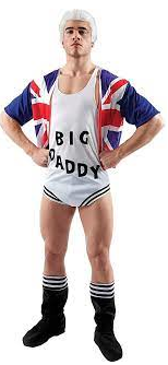 Like a super hero, fists on waist and chest puffed out, stands Big Daddy. Thick thighs shoot from calf high black boots. A white leotard has Big Daddy written in block capitals. They are wearing a union jack crop top that is split down the middle, exposing the deep circular neck of the leotard. Big Daddy has an emotionless face, rather large and shiny chin while sporting icy white hair.