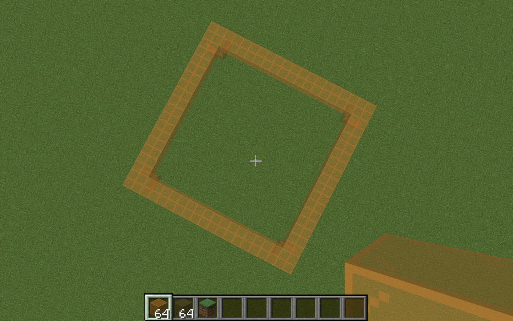 Screenshot of my Minecraft build: the base of the bedside table against the green grass.