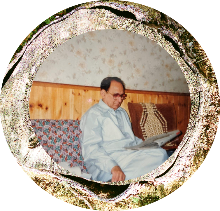 A perfectly round image of my grandfather with a ringed frame of a chopped tree trunk. This image is taken from the previous image and made larger to expose some details. These include the wooden wall of his house, the newspaper he is engrossed in and the sepia tint of his spectacles. 
