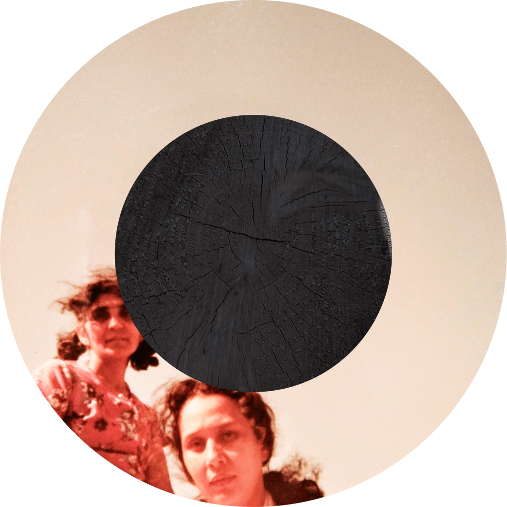 This circular photograph contains the image of two 'almost smiling' women, looking softly at the camera with a lightness but strength of purpose.  It is the artists grandmother and her best friend. Obscuring the center of the image is a circle filled with the texture of a chopped texture but blackened to approximate the Syahi, the centerpoint of the tabla.